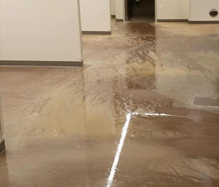 Standing water on the floor of a corridor